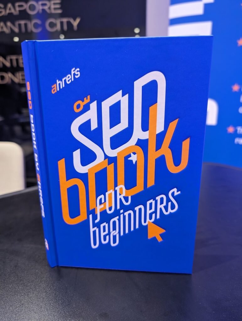 A blue book on a table ahrefs - digital agency