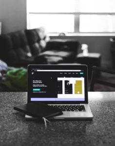 focus photo of black and white laptop computer turned on diseño web 